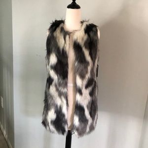 Brand new fluffy coat/vest? Never worn. Multi color fur in the front. Size M.